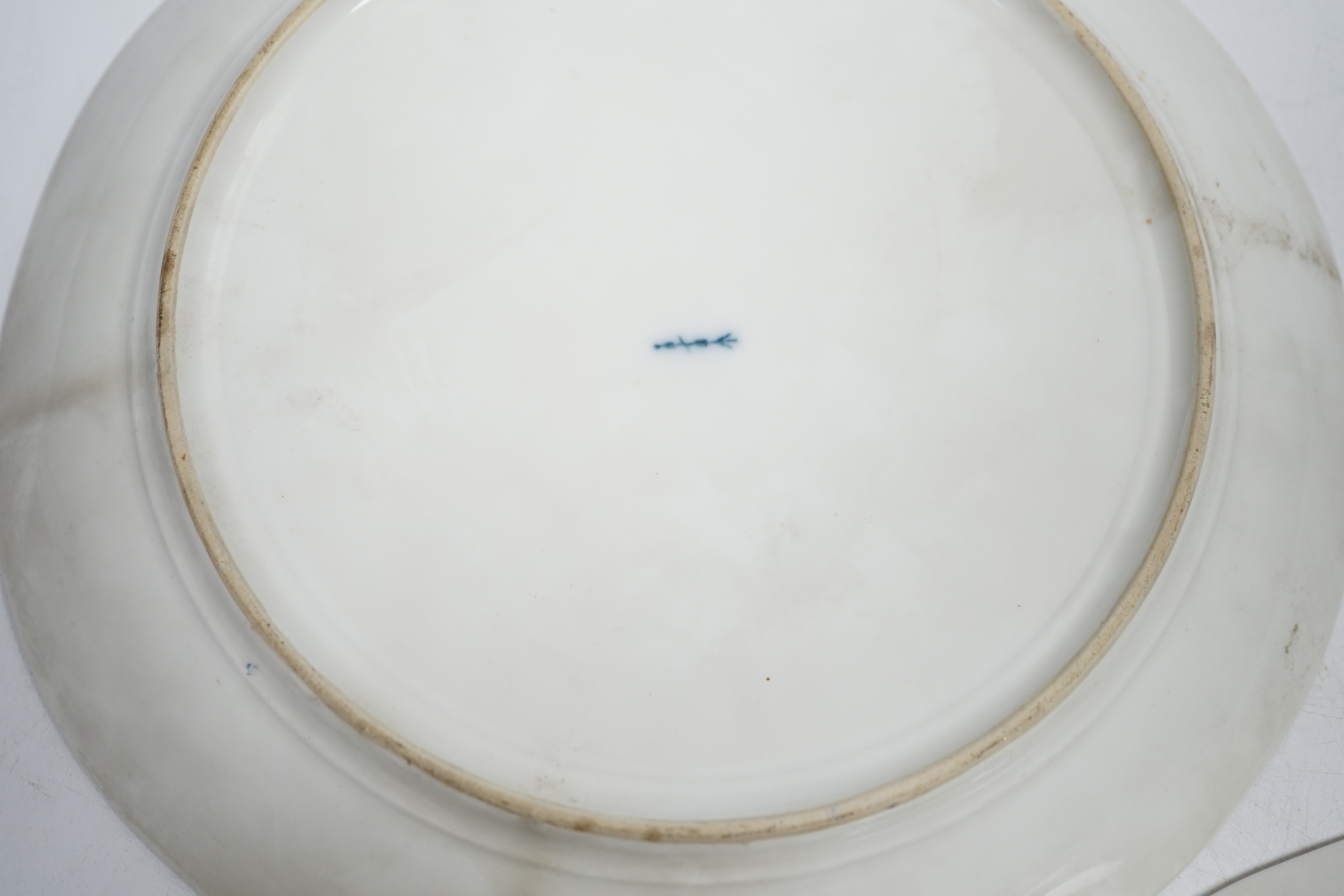 A pair of late 19th century Berlin plates, hand painted with females, 21.5cm